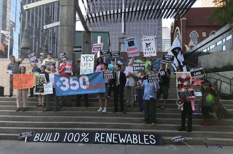 FILE PHOTO: Protesters gather outside the Exxon shareholders' meeting in Dallas