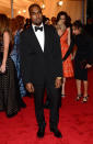 <p class="MsoNoSpacing">What an understated look for Kanye West. The rapper shunned his usual wild fashion flair for a simple black tuxedo. Meanwhile, his usual accessory, Kim Kardashian, was home in California.</p>