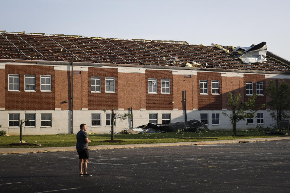 A section of roof remains torn from Brookville High School after a tornado hit the area the previous evening, Tuesday, May 28, 2019, in Brookville, Ohio.  (Photo: John Minchillo/AP)