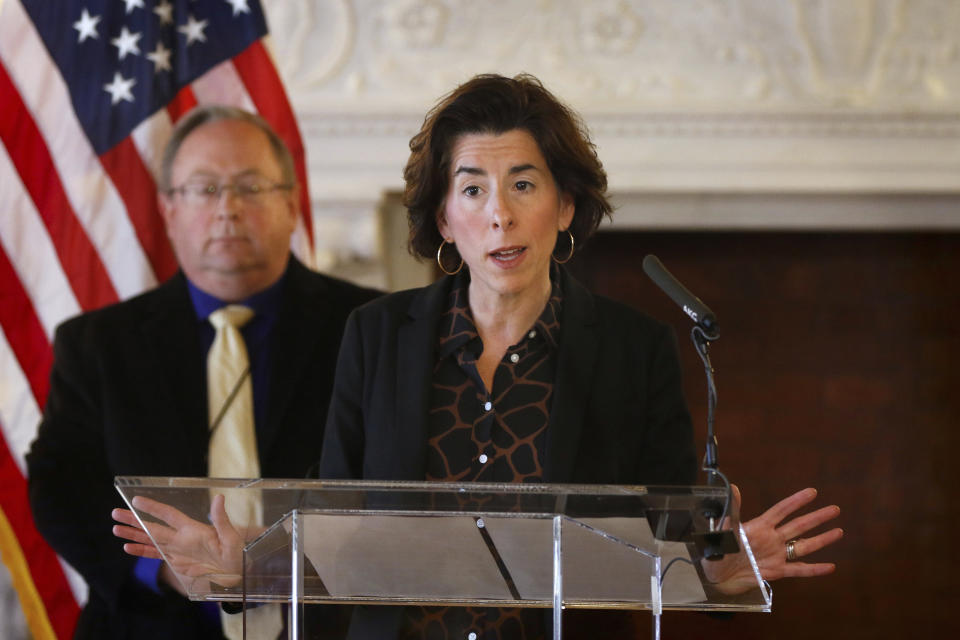 FILE - In this Sunday, March 22, 2020, file photo, Gov. Gina Raimondo gives an update on the coronavirus during a news conference, in Providence, R.I. Many states have yet to spend the federal funding they got to help with soaring costs related to the coronavirus crisis, making it tougher for states and cities to argue that they need hundreds of billions more from U.S. taxpayers. “If I knew today that another billion dollars was coming to Rhode Island to help solve our budget deficit, I’d spend the $1.25 billion now,” Raimondo said about the state's portion of money. “Lots of other governors are spending. They’re taking a gamble, and I’m just not ready to do that yet.” (Kris Craig/Providence Journal via AP, Pool, File)