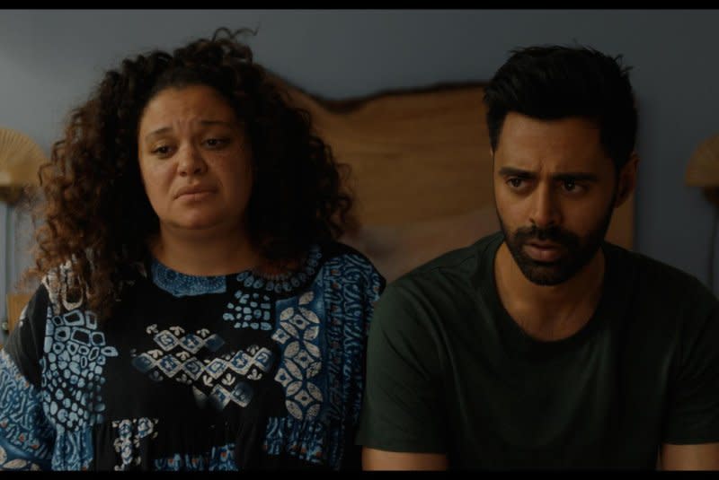 Dawn (Michelle Buteau) and her husband Marty (Hasan Minhaj) are exhausted. Photo courtesy of Neon