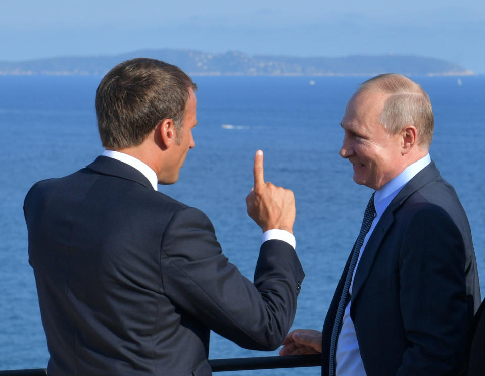 French President Emmanuel Macron, left, gestures as he talks with Russian President Vladimir Putin during their meeting at the fort of Bregancon in Bormes-les-Mimosas, southern France, Monday Aug. 19, 2019. French President Emmanuel Macron and Russian President Vladimir Putin are meeting to discuss the world's major crises, including Ukraine, Iran and Syria, and try to improve Moscow's relations with the European Union. (Alexei Druzhinin, Sputnik, Kremlin Pool Photo via AP)