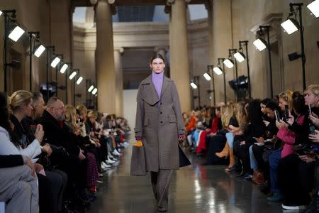 Models present creations at the Victoria Beckham show during London Fashion Week Women's A/W19 in London, Britain February 17, 2019. REUTERS/Henry Nicholls