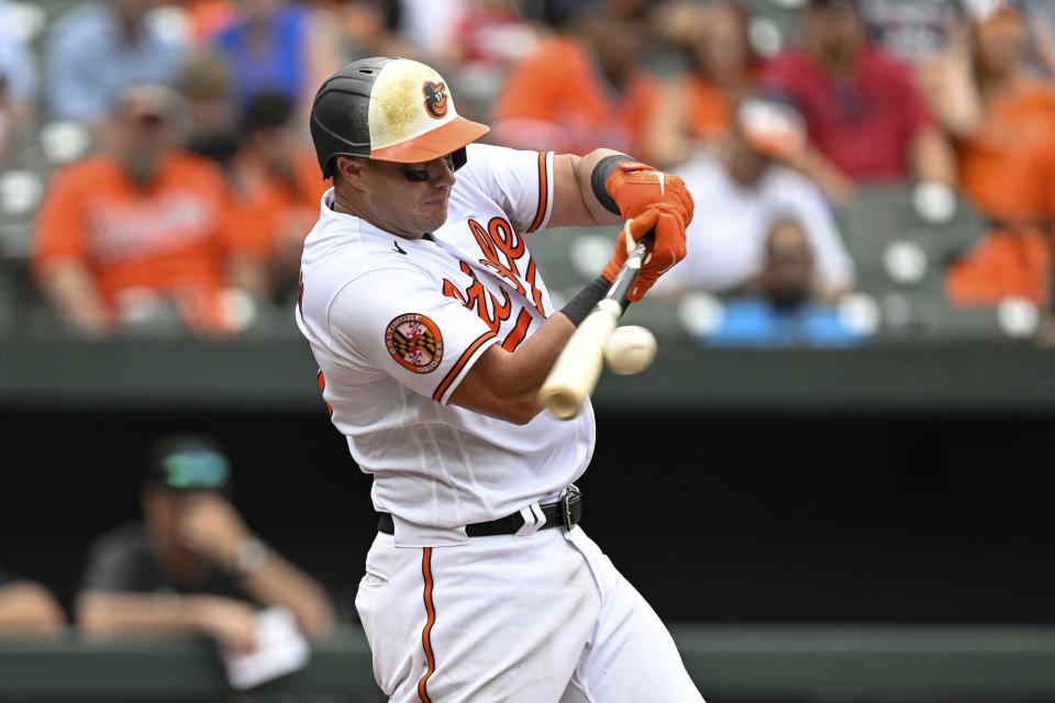 Baltimore Orioles' James McCann hits a single off Miami Marlins relief pitcher Johnny Cueto during the seventh inning of a baseball game, Sunday, July 16, 2023, in Baltimore. (AP Photo/Terrance Williams)