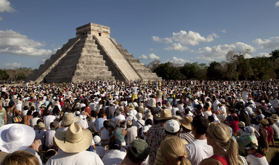 People look at the pyramid of Chichen Itza in the southern Mexican state of Yucatan