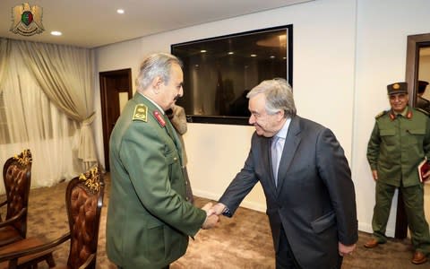 A handout photo made available by Libyan Army Media office on 05 April 2019 shows Secretary General of the United Nations Antonio Guterres (R) shaking hands with commander of the Libyan National Army (LNA) Khalifa Haftar (L) in Benghazi, eastern Libya  - Credit: LIBYAN ARMY MEDIA OFFICE HANDOUT/EPA-EFE/REX