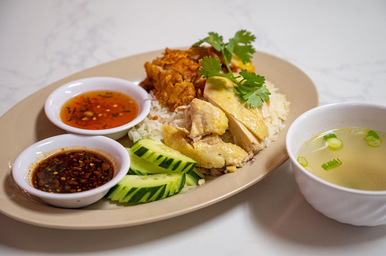 P Thai's Khao Man Gai serves fried and steamed versions of the stall's titular chicken fat rice dish.