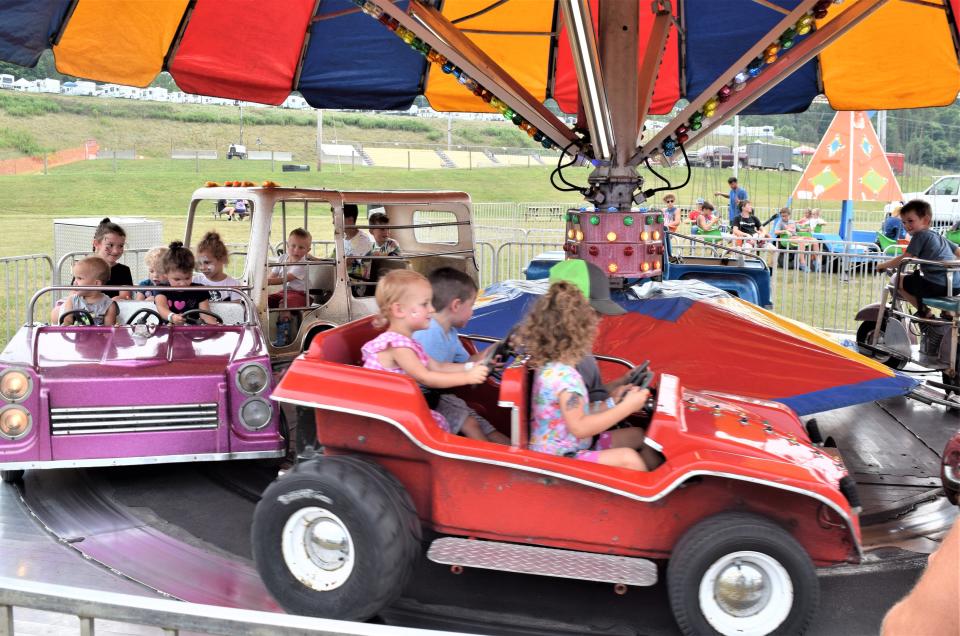Youngsters enjoy going for a drive at the Holmes County Fair.