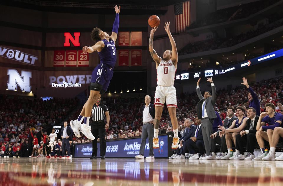 Northwestern's Ty Berry (3) defends against a shot by Nebraska's C.J. Wilcher (0) during the first half of an NCAA college basketball game Wednesday, Jan. 25, 2023, in Lincoln, Neb. (AP Photo/Rebecca S. Gratz)