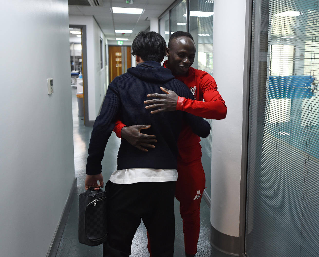 LIVERPOOL, ENGLAND - DECEMBER 31: (THE SUN OUT, THE SUN ON SUNDAY OUT) Takumi Minamino new signing of Liverpool on his first day with Sadio Mane of Liverpool at Melwood Training Ground on December 31, 2019 in Liverpool, England. (Photo by Andrew Powell/Liverpool FC via Getty Images)