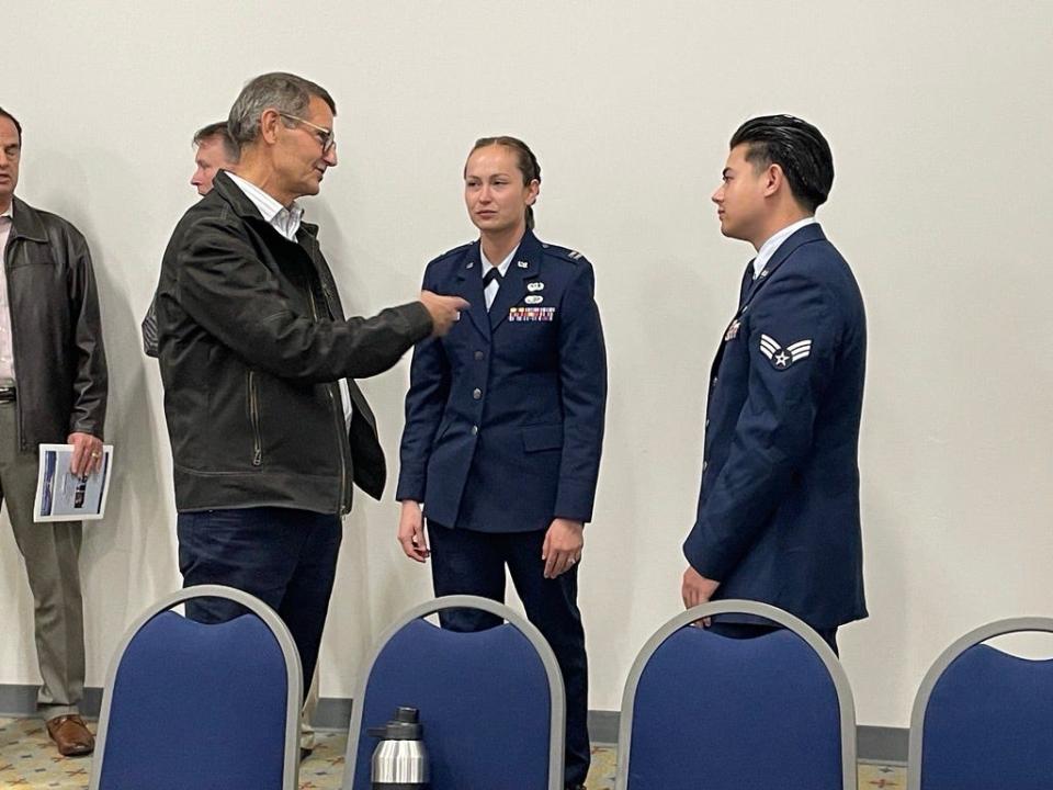 Citizen talks with Dyess Public Affairs personnel at the B-21 public scoping meeting on Dec. 5, 2023. The meeting's purpose is to allow the public to comment on potential environmental impacts of the proposed beddown of the Department of Defense's new bomber aircraft.