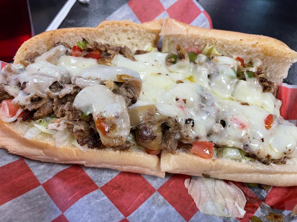 The traditional Philly cheesesteak sandwich at Big Orange Philly's has thin slices of steak covered with sauteed peppers, onions and — in a slight twist — mushrooms.