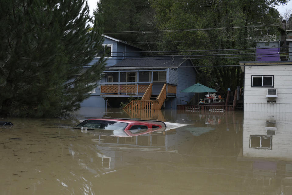 A truck is seen submerged in the flood waters of the Russian River in Forestville, north of San Francisco, Feb. 27, 2019. (Photo: Michael Short/AP)