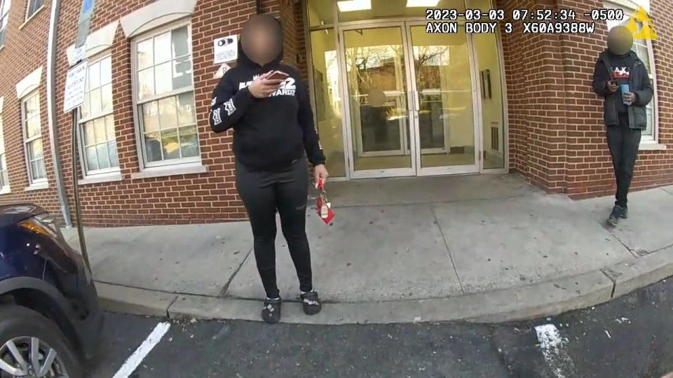 A still image taken from police body cam released in the Najee Seabrooks case showing moments when officers first arrived at the Mill St. apartment in response to a 911 call by Seabrooks. Here, two people request that the officer call an ambulance for a man who is hallucinating.