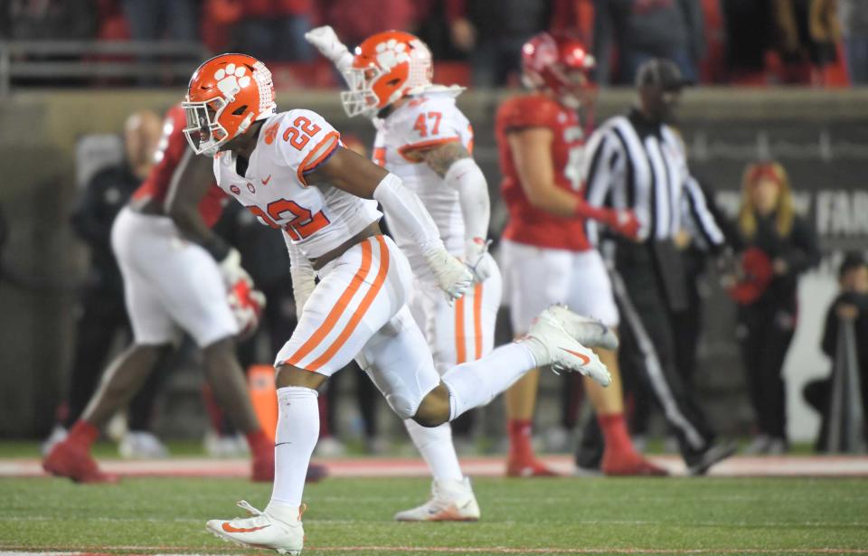 Clemson linebacker Trenton Simpson (22) and  linebacker James Skalski (47) celebrate a fourth down stop at the four-yard line with 10 seconds left in the fourth quarter at Cardinal Stadium in Louisville, Kentucky Saturday, November 6, 2021.