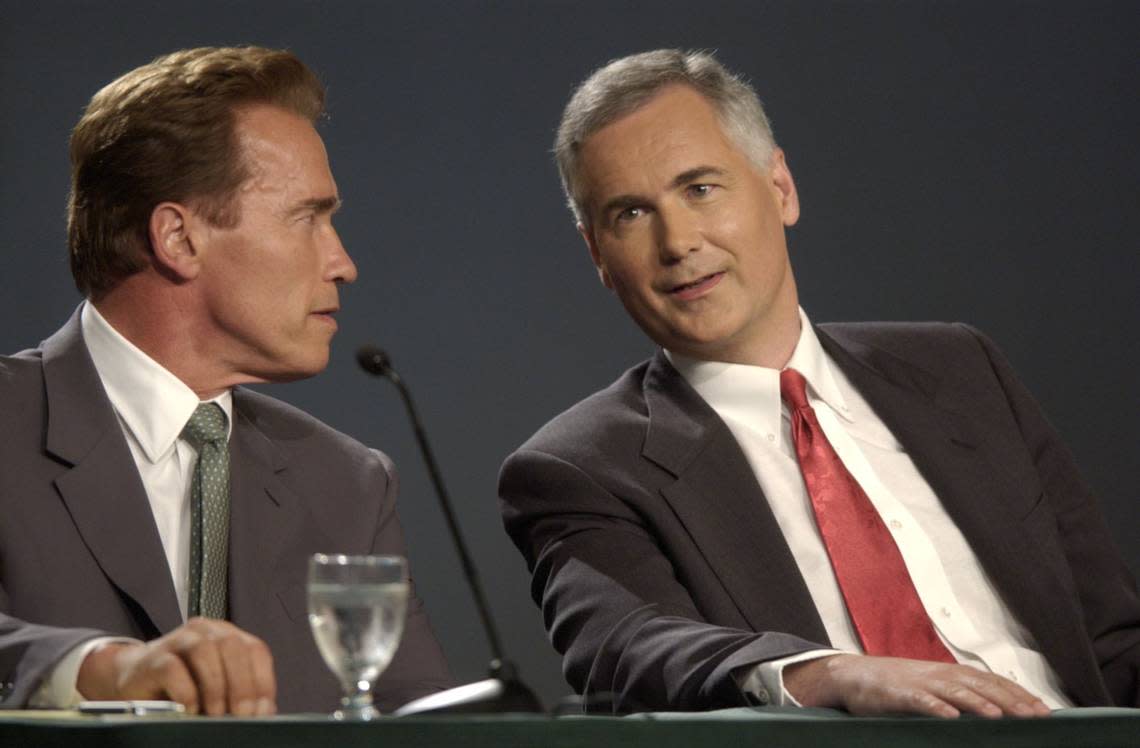 Republican gubernatorial recall candidates Arnold Schwarzenegger and state Sen. Tom McClintock talk before the start of a 90-minute televised debate sponsored by the California Broadcasters Association at the University Union at Sacramento State on Sept. 24, 2003. John Decker/Sacramento Bee file