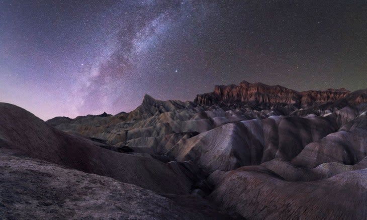 Winter night sky among the Death Valley badlands at Zabriskie Point.