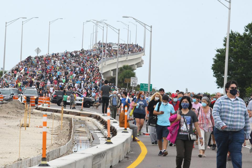 Crowds of SpaceX spectators leave the A. Max Brewer Bridge on May 29 in Titusville, Fla., after the launch was scrubbed.