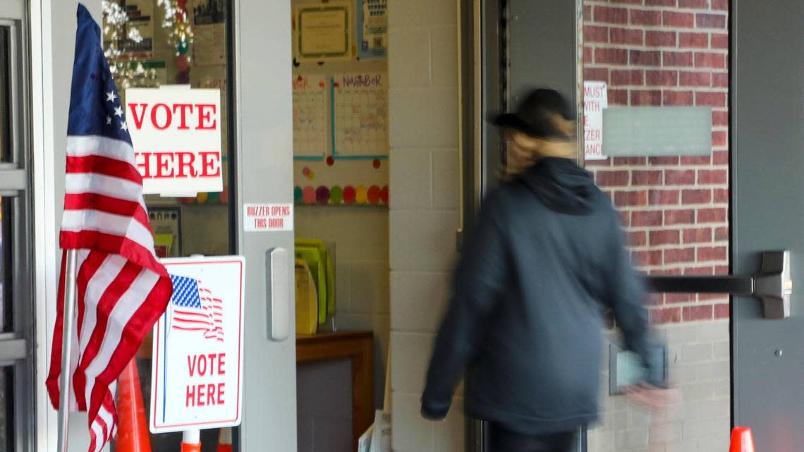 A voter enters Veterans Park Elementary School to cast a ballot on election day, Tuesday, Nov. 8, 2022 in Lexington, Ky.