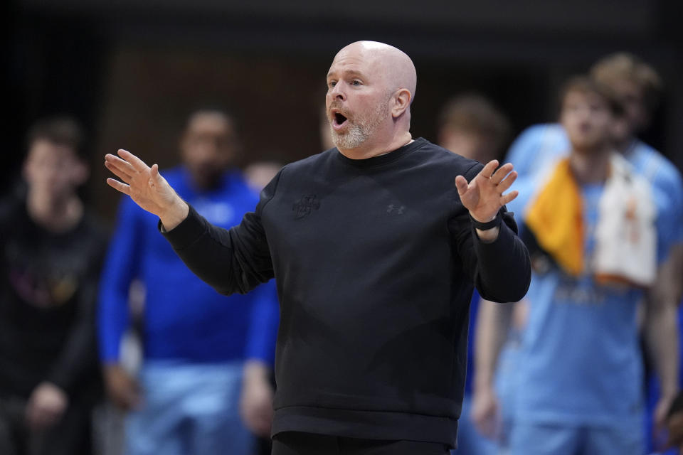 Indiana State head coach Josh Schertz reacts in the second half of an NCAA college basketball game against Utah in the semifinals of the NIT, Tuesday, April 2, 2024, in Indianapolis. Indiana State won 100-90. (AP Photo/Michael Conroy)