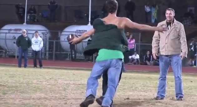 The parent of a Placer football player tackles a rather rude field intruder — YouTube