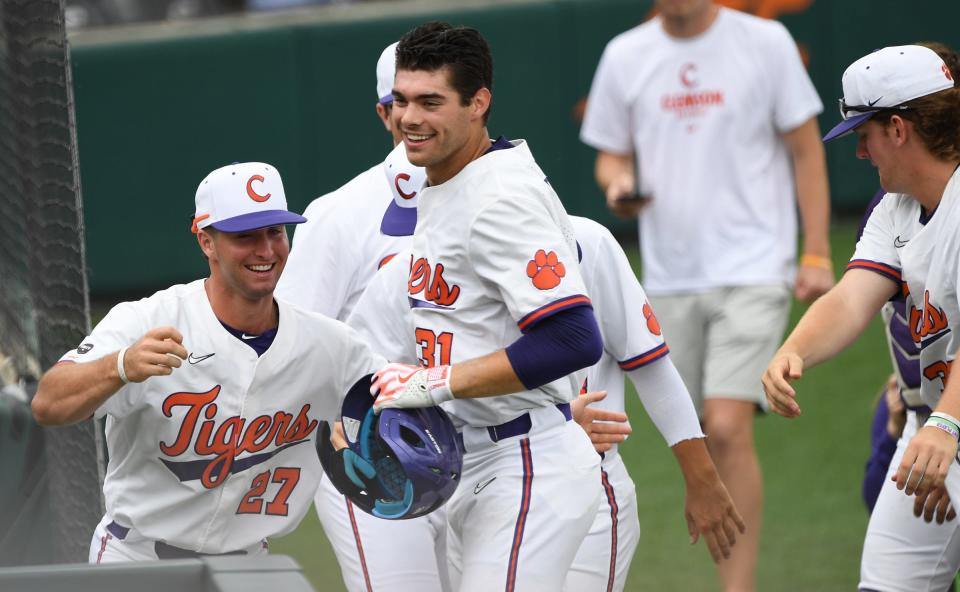 Clemson junior Caden Grice (31) celebrates with teammates after hitting a home run against University of North Carolina during the bottom of the first inning at Doug Kingsmore Stadium in Clemson Saturday, May 20, 2023.