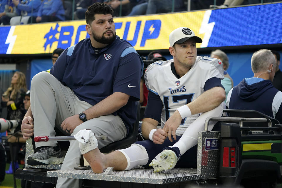 Tennessee Titans quarterback Ryan Tannehill, right, is carted off the field during the first half of an NFL football game against the Los Angeles Chargers in Inglewood, Calif., Sunday, Dec. 18, 2022. (AP Photo/Marcio Jose Sanchez)