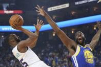 March 31, 2019; Oakland, CA, USA; Charlotte Hornets guard Kemba Walker (15) shoots the basketball against Golden State Warriors forward Draymond Green (23) during the first quarter at Oracle Arena. Mandatory Credit: Kyle Terada-USA TODAY Sports