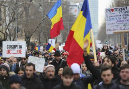 People demonstrate against a cabinet decree passed earlier in the week decriminalising some graft offences, in Bucharest, Romania February 4, 2017. REUTERS/Stoyan Nenov