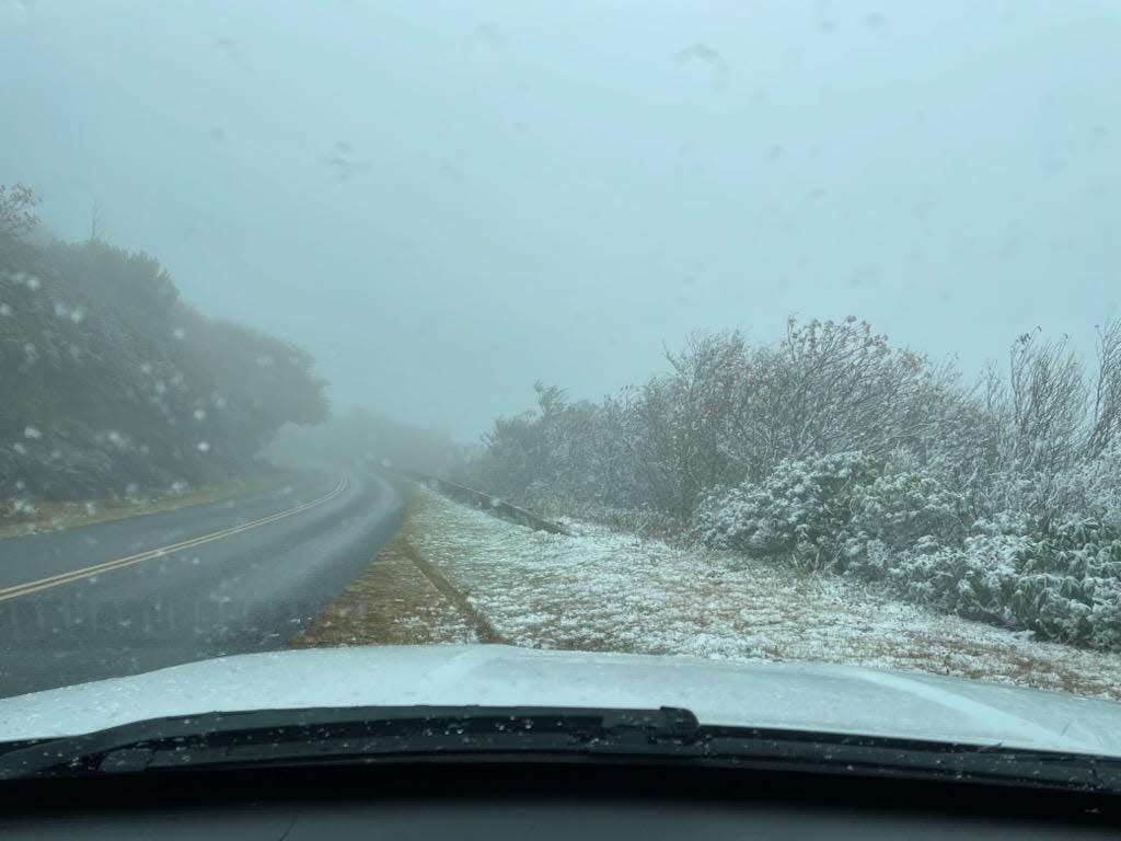 The first snowfall of the season lightly dusts the Blue Ridge Parkway Oct. 16, 2023, north of Asheville.