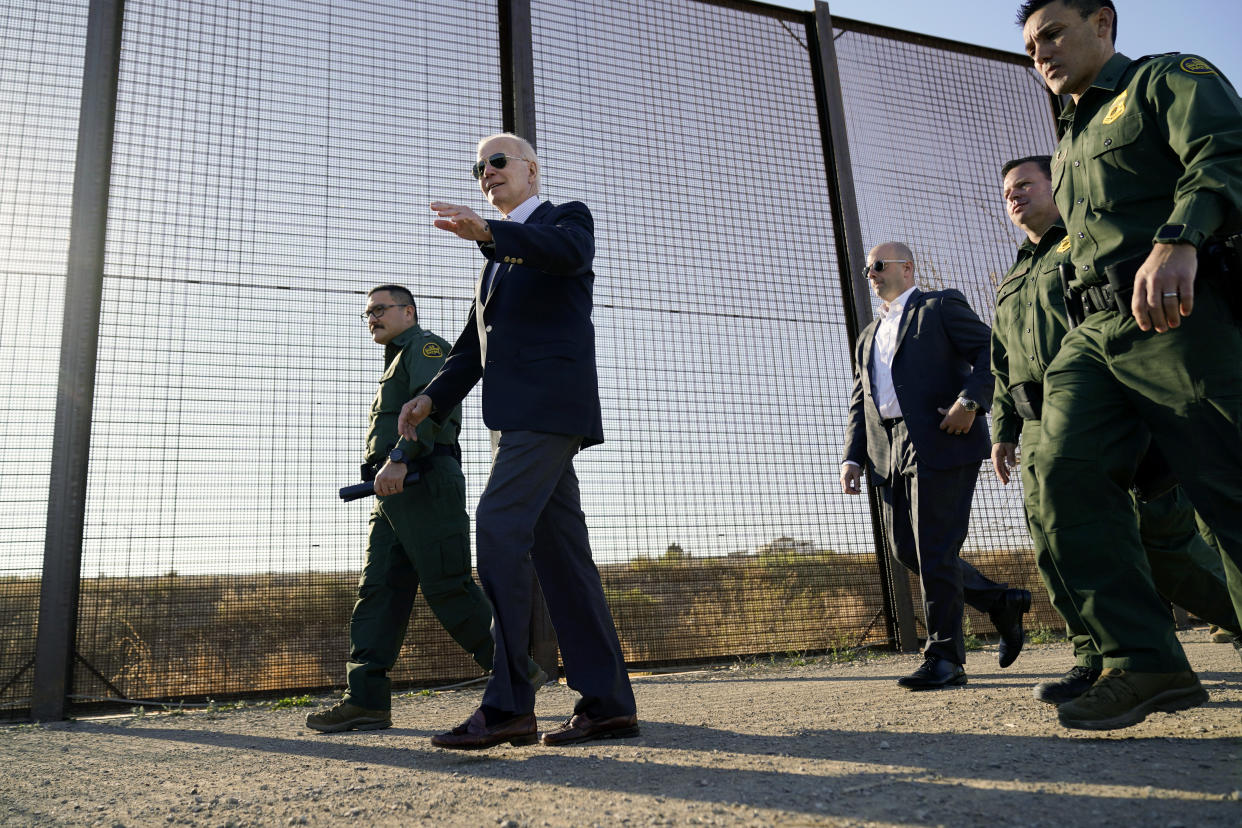 FILE - President Joe Biden walks along a stretch of the U.S.-Mexico border in El Paso Texas, Jan. 8, 2023. The Biden administration has requested 1,500 troops for the U.S.-Mexico border amid an expected migrant surge following the end of pandemic-era restrictions. (AP Photo/Andrew Harnik, File)