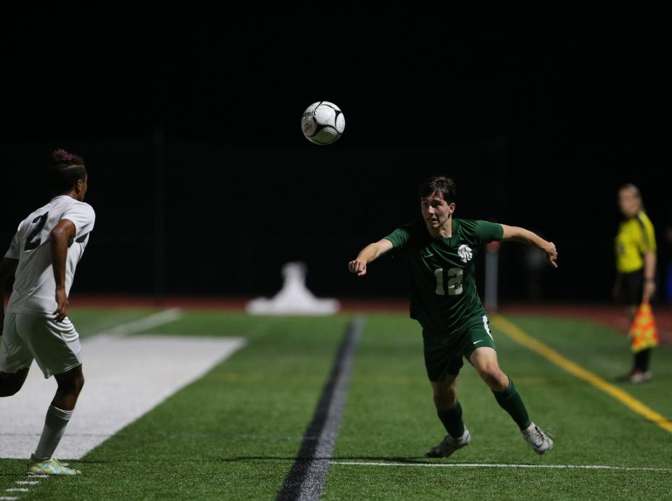 Spackenkill's Chase Bosko eyes the ball as O'Neill's Jorge Yeye closes in on him during Thursday's Section 9 Class B semifinal on October 26, 2023.