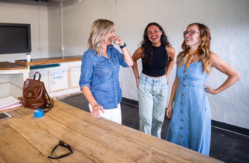 Debbie Cooper, far left, the owner and operator of Buck + Board stands in their newest location with two of her employees, Abigail Crowther, center and Sara Carlton, far right in Columbia, Tenn. on Aug. 30, 2022