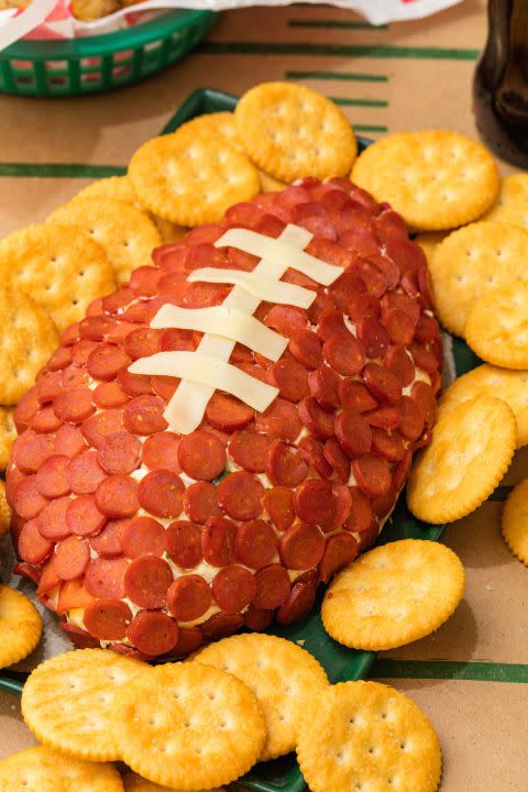 <p>No catch here. Just a LOT of cheese and crackers. </p><p>Get the <a href="http://www.delish.com/cooking/recipe-ideas/recipes/a49406/pepperoni-football-recipe/" rel="nofollow noopener" target="_blank" data-ylk="slk:Pepperoni Football recipe;elm:context_link;itc:0;sec:content-canvas" class="link "><strong>Pepperoni Football recipe</strong></a> from Delish. </p>