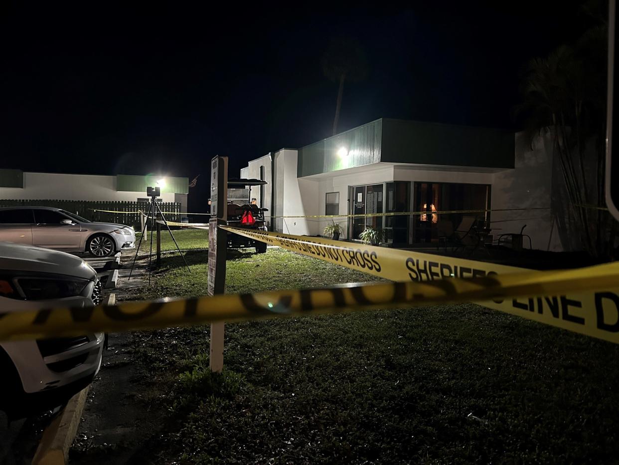 Gathered in the parking lot area of American Golf Club at 100 Woodland Drive, Indian River County Sheriff's Office crime scene investigators can be seen working outside an office area late into Monday, Feb. 19, 2024, following a fatal shooting that evening.