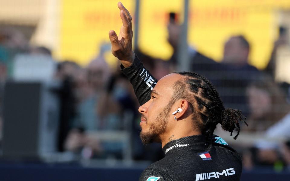 Bahrain International Circuit, Sakhir, Bahrain - March 5, 2023 Mercedes' Lewis Hamilton waves to fans during the drivers parade before the race - REUTERS/Nir Elias