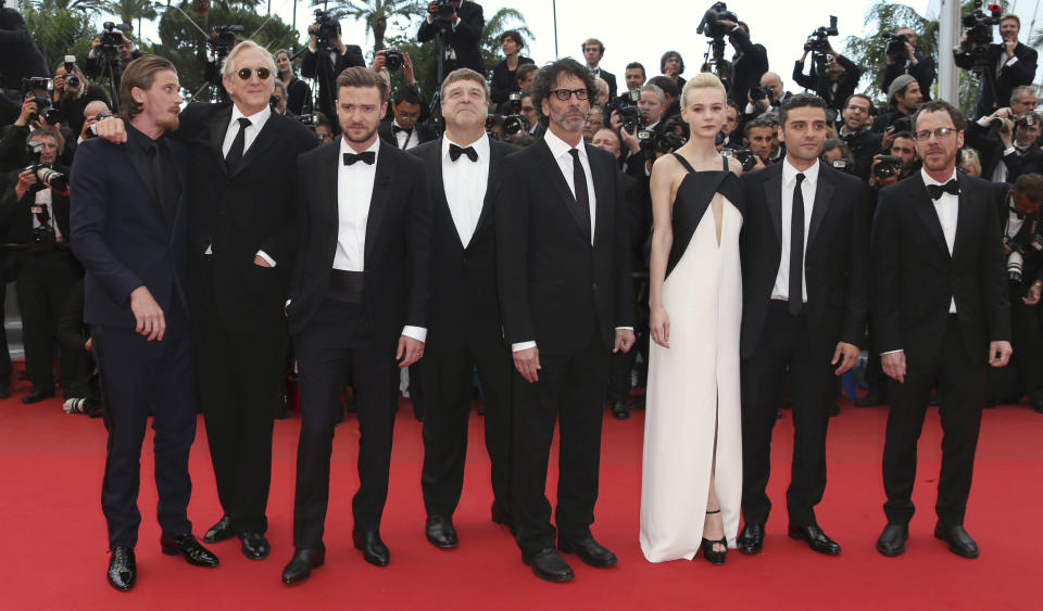 Cast members, from left, Garrett Hedlund, T-Bone Burnett, Justin Timberlake, John Goodman, Joel Coen, Carey Mulligan, Oscar Isaac, and Ethan Coen pose for photographers as they arrive for the screening of Inside Llewyn Davis at the 66th international film festival, in Cannes, southern France, Sunday, May 19, 2013. (Photo by Joel Ryan/Invision/AP)