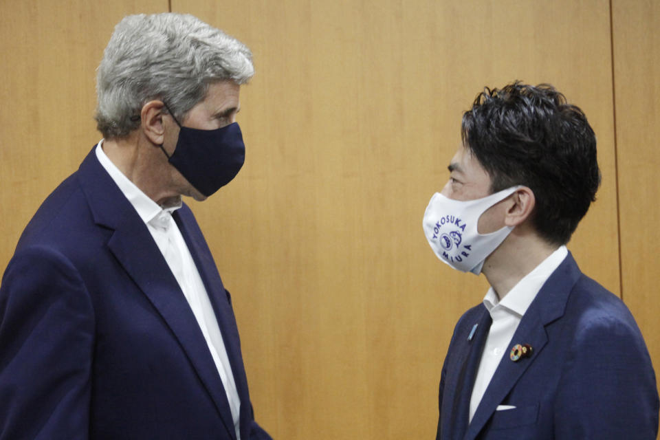 U.S. Special Presidential Envoy for Climate John Kerry, left, meets Japanese Environment Minister Shinjiro Koizumi at the latter's ministry in Tokyo, Tuesday, Aug. 31, 2021. Kerry was in Tokyo to discuss efforts to fight climate change with top Japanese officials ahead of a United Nations conference in November. (AP Photo/Koji Sasahara, Pool)