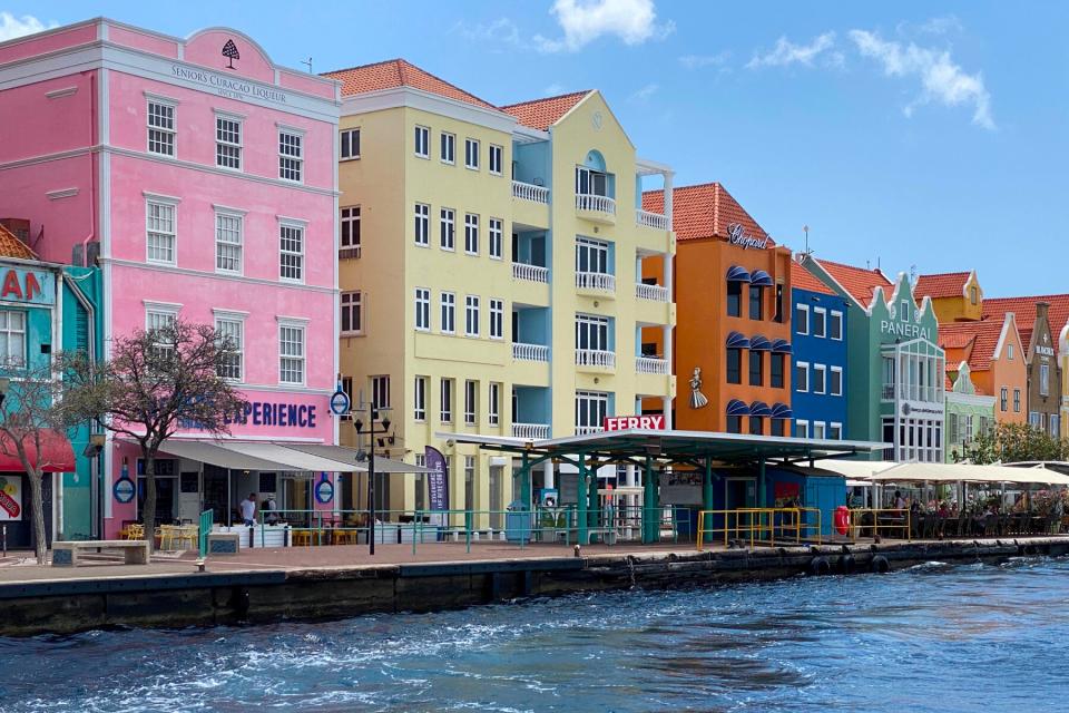 pastel colored colonial buildings on the waterfront of old town Willemstad, Curacao