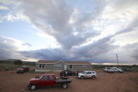 This Wednesday, May 8, 2019 photo shows the mobile home where Miranda Haskie has lived with her husband, Jimmie Long Jr. and son, Jayden Long, 13, in Kaibeto on the Navajo Reservation for more than a decade without mains electricity. On Thursday, May 9, 2019 their isolated home was connected to the grid. An ambitious project to connect homes to the electric grid on the country's largest American Indian reservation is wrapping up. Utility crews from across the U.S. have volunteered their time over the past few weeks to hook up about 300 homes on the Navajo Nation. (AP Photo/Jake Bacon)