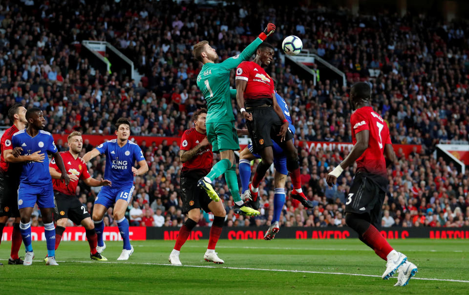 <p>Soccer Football – Premier League – Manchester United v Leicester City – Old Trafford, Manchester, Britain – August 10, 2018 Manchester United’s Paul Pogba in action with David De Gea Action Images via Reuters/Andrew Boyers EDITORIAL USE ONLY. No use with unauthorized audio, video, data, fixture lists, club/league logos or “live” services. Online in-match use limited to 75 images, no video emulation. No use in betting, games or single club/league/player publications. Please contact your account representative for further details. </p>