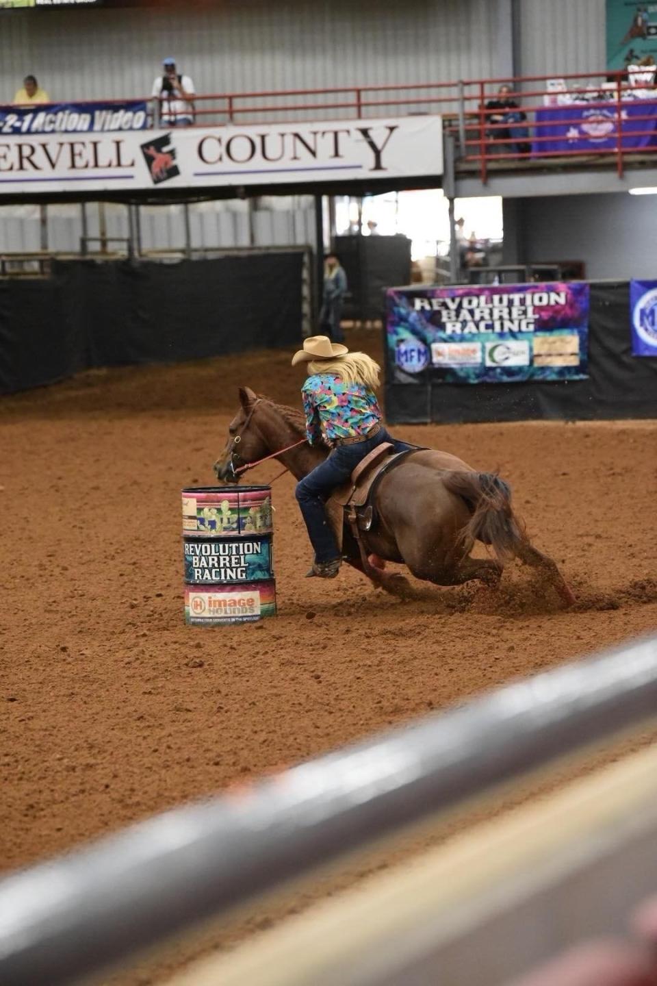 Angela Ganter takes a tight corner at a rodeo in Glen Rose.