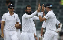 England's Moeen Ali (C) is congratulated by teammates after he bowled out South Africa's Dean Elgar (not pictured) during the third cricket test match in Johannesburg, South Africa, January 14, 2016. REUTERS/Siphiwe Sibeko