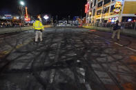 Tire marks cover the street after the Burnouts on Broadway competition as part of NASCAR Champion's Week on Wednesday, Dec. 1, 2021, in Nashville, Tenn. (AP Photo/Mark Humphrey)