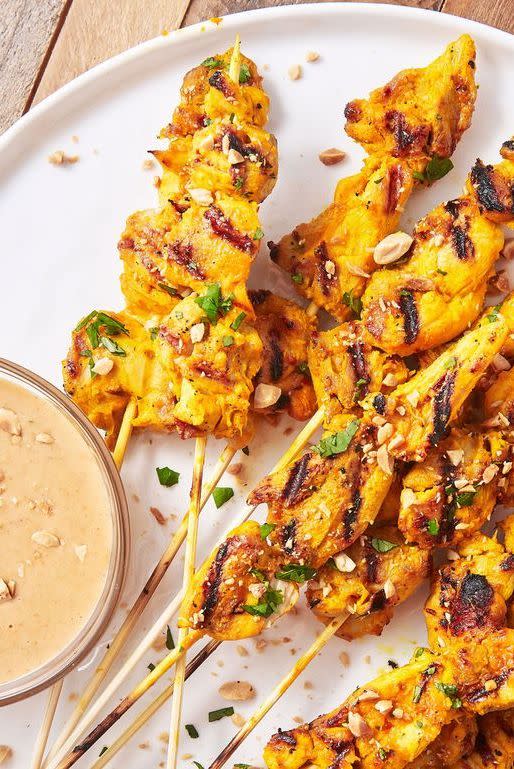 <p>Satay, considered to be a national dish of Indonesia, is a popular Southeast Asian <a href="https://www.delish.com/cooking/recipe-ideas/g41515171/street-food-recipes/" rel="nofollow noopener" target="_blank" data-ylk="slk:street food" class="link ">street food</a> that usually involves a marinated meat being skewered and grilled, then served with a simple saucy dip. Our peanut sauce is the ultimate wingman to satay, containing all the fragrant notes of lemongrass, coconut, fish sauce, and fresh lime zest.</p><p>Get the <strong><a href="https://www.delish.com/cooking/recipe-ideas/a27198099/chicken-satay-recipe/" rel="nofollow noopener" target="_blank" data-ylk="slk:Chicken Satay recipe" class="link ">Chicken Satay recipe</a></strong>.</p>