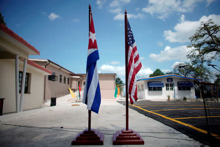 FILE PHOTO: U.S. and Cuban flags are displayed at the Ernest Hemingway Museum during an event with U.S. Congressman James Mcgovern (not pictured) in Havana, Cuba, March 30, 2019. REUTERS/Alexandre Meneghini/File Photo