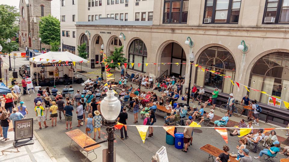 People gather on Purchase Street, in 2019, to enjoy the New Bedford Folk Festival. The event returns, after a two year break, on July 9.