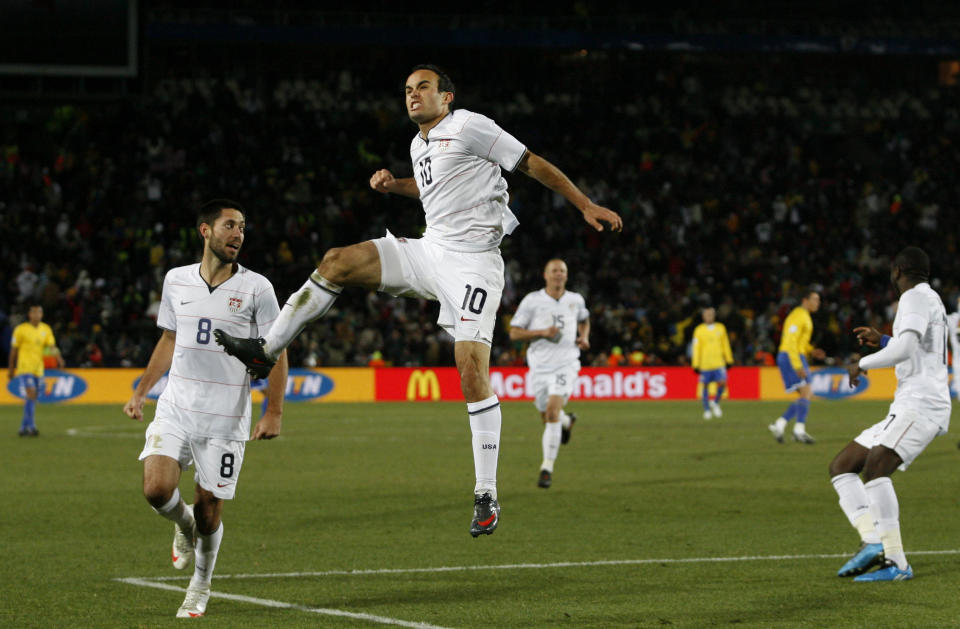 FILE - USA's Landon Donovan, center, reacts after scoring their second goal, with fellow team members Clint Dempsey, left, Jay DeMerit, background center, and Jozy Altidore, right, during their Confederations Cup final soccer match against Brazil, at Ellis Park Stadium in Johannesburg, South Africa, Sunday, June 28, 2009. Landon Donovan is teaming with Clint Dempsey again at a World Cup. The pair, who share the American record of 57 international goals, will work for Fox at this year’s tournament in Qatar. (AP Photo/Paul Thomas, File)