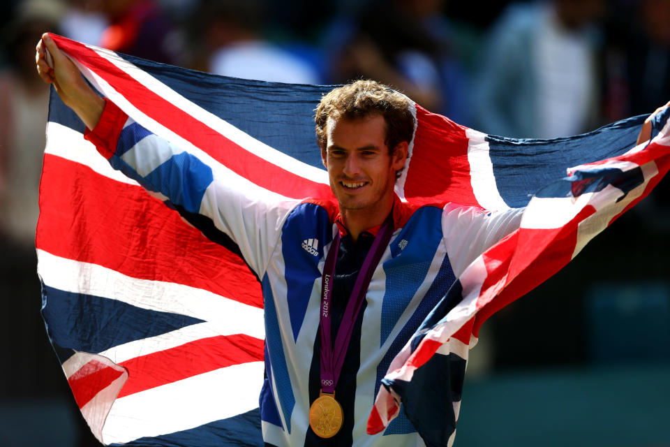 LONDON, ENGLAND - AUGUST 05: Gold medalist Andy Murray of Great Britain poses during the medal ceremony for the Men's Singles Tennis match on Day 9 of the London 2012 Olympic Games at the All England Lawn Tennis and Croquet Club on August 5, 2012 in London, England. Murray defeated Federer in the gold medal match in straight sets 2-6, 1-6, 4-6. (Photo by Paul Gilham/Getty Images)