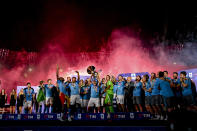 Napoli's players celebrate after winning the Serie A soccer title trophy at the Diego Maradona Stadium, in Naples, Sunday, June 4, 2023.(Ciro Fusco/ANSA, Pool Photo via AP)